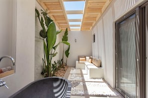 Deluxe Room, Private Bathroom, Garden Area | Living area
