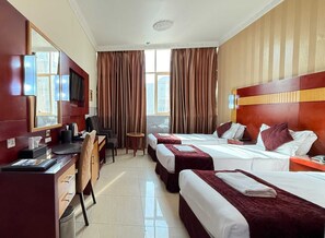 Suite exécutive | Literie de qualité, minibar, bureau, accès au Wi-Fi (inclus)