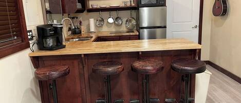 Fridge, microwave, stovetop, coffee/tea maker