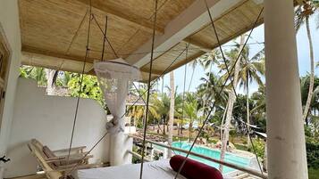 Deluxe Bungalow, Balcony, Pool View | Terrace/patio