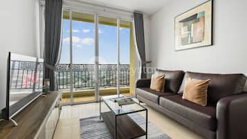 Apartment, 2 Bedrooms, City View | Living area | 43-inch Smart TV with cable channels, Netflix, streaming services