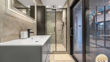 Shower, hair dryer, towels, soap
