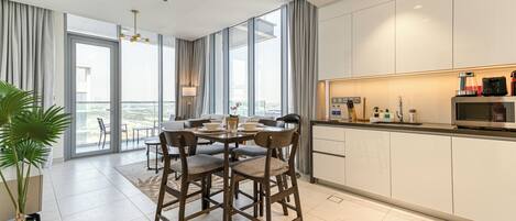 Exclusive Apartment, Balcony, Lagoon View | In-room dining