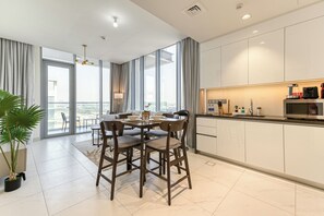 Exclusive Apartment, Balcony, Lagoon View | In-room dining