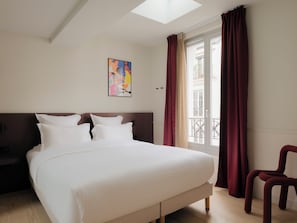 Premium bedding, memory foam beds, desk, laptop workspace