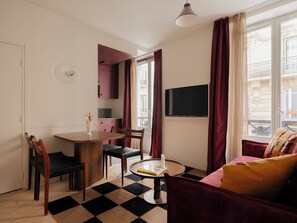 One-Bedroom Apartment | Living area | 50-inch flat-screen TV with satellite channels, Netflix