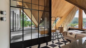 A modern room with a large window, a bed, a small table, and a view of the outdoors. - IJG Imperial Smrekowa (Zakopane)