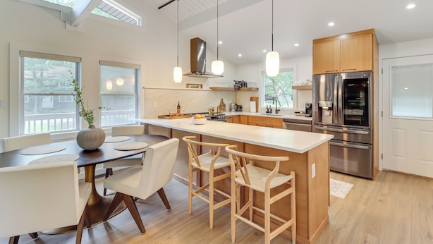 A modern kitchen with a central island, stainless steel appliances, and pendant lighting. - Pool + Lake Access, Yard: Poconos Family Getaway (East Stroudsburg)