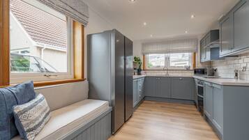 Coffee/tea maker, fridge, microwave, oven