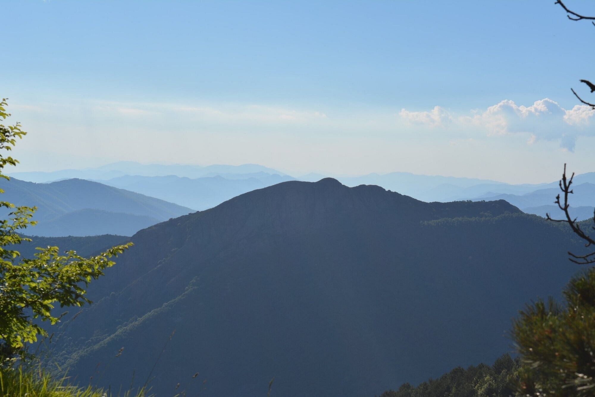 A mountain landscape with a clear sky.