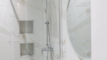 Shower, hair dryer, towels, toilet paper