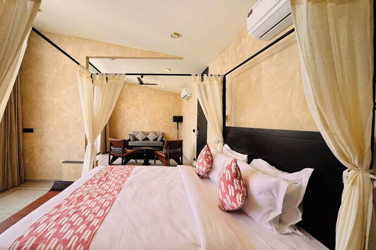 Suite, Partial Lake View | Minibar, in-room safe, desk, laptop workspace