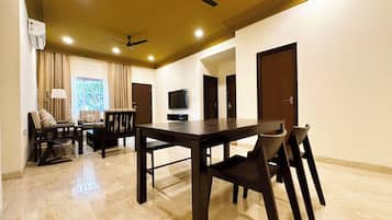 Signature Suite, 2 Bedrooms | Living area | 43-inch TV with digital channels