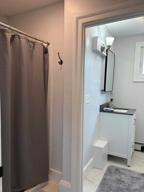 Shower, towels, soap, toilet paper