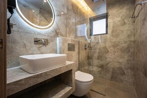 Shower, hair dryer, slippers, towels