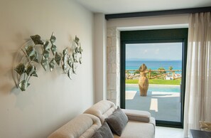 Emerald Villa ​w​ith Private Pool | Living area | 43-inch flat-screen TV with satellite channels - Sunrise Villas Collection (Kassandra)