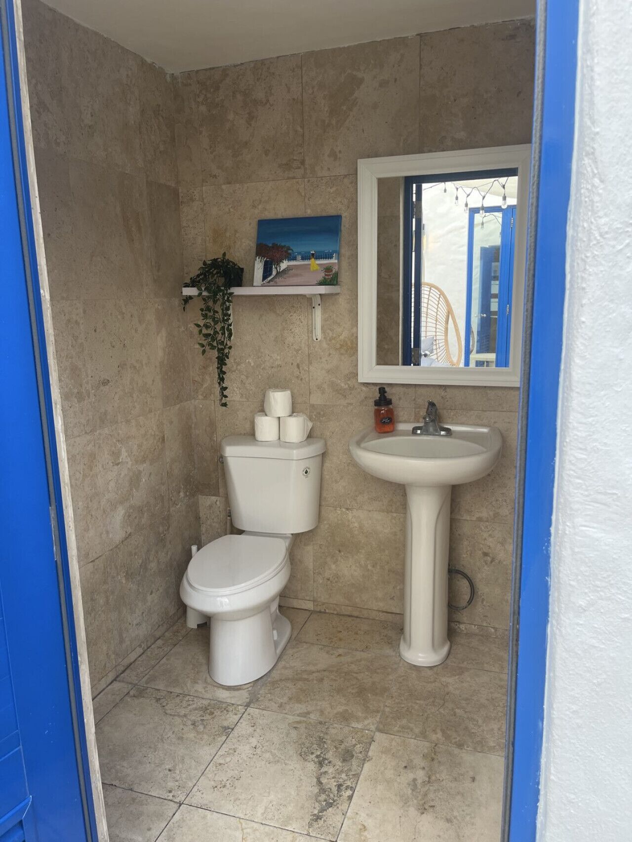 Two half bathrooms in pool area, shared by other guests