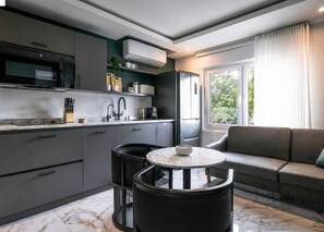 Fridge, microwave, stovetop, coffee/tea maker