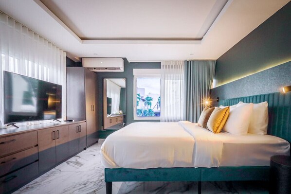 1 bedroom, desk, iron/ironing board, travel crib