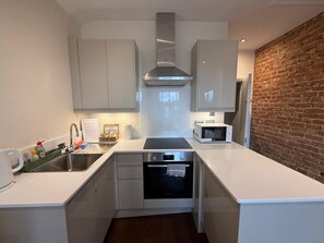 Fridge, microwave, oven, dining tables