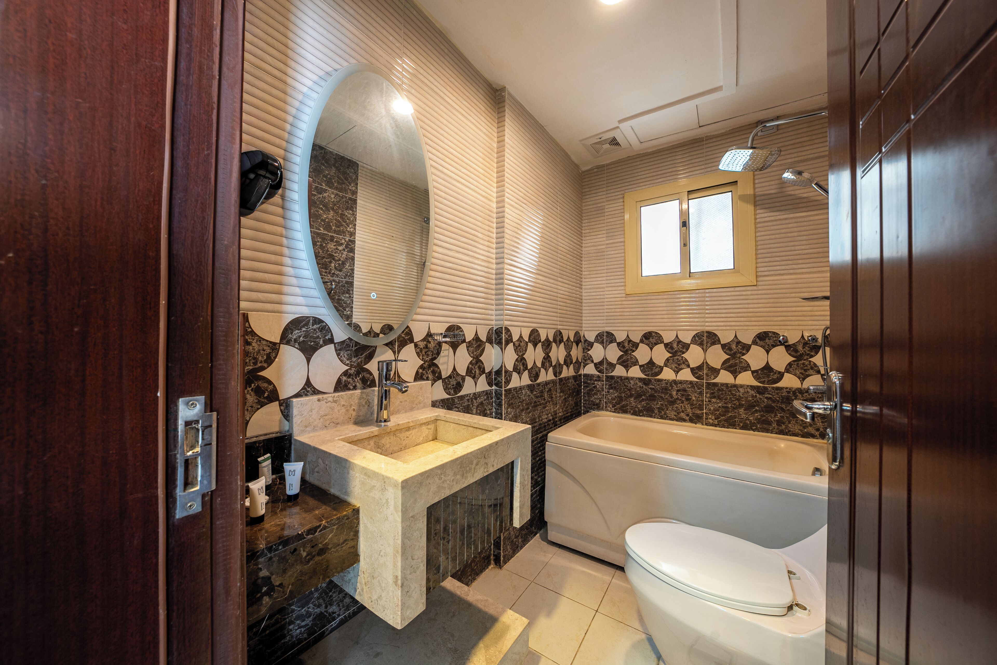 A bathroom with a bathtub, a sink, and a toilet.