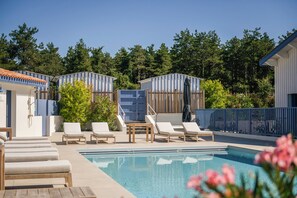 Seasonal outdoor pool, open 10:00 AM to 8:00 PM, pool umbrellas