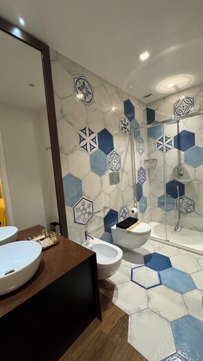 Deluxe Suite, Balcony, City View | Bathroom | Bathrobes, slippers