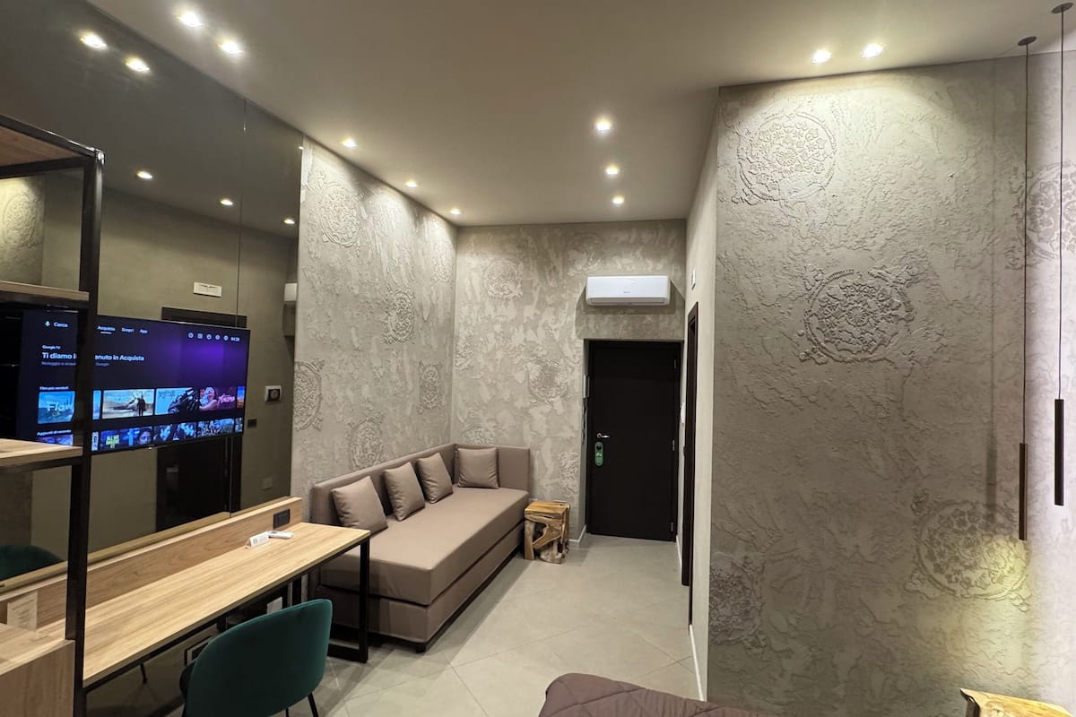 Deluxe Triple Room, Balcony, City View | In-room safe, blackout drapes, soundproofing, iron/ironing board