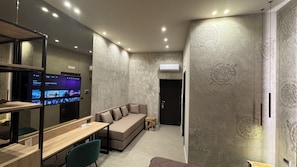 Deluxe Triple Room, Balcony, City View | Minibar, in-room safe, blackout drapes, soundproofing
