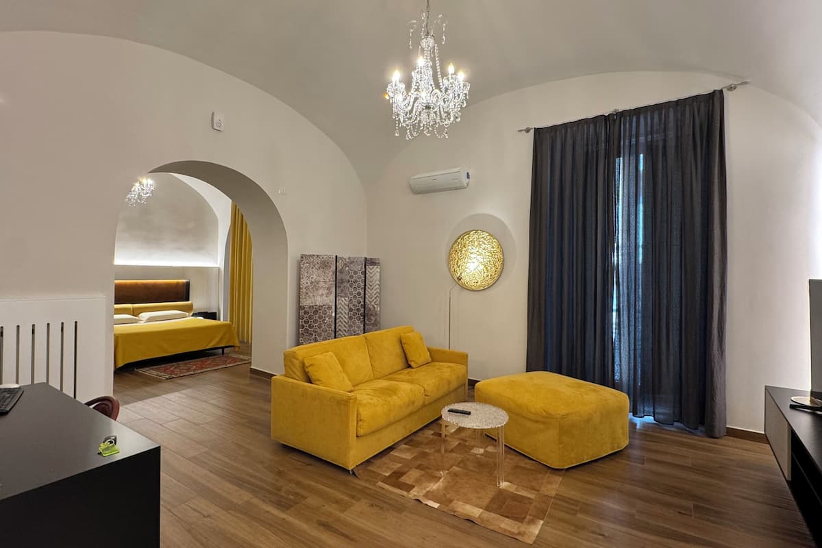 Deluxe Suite, Balcony, City View | In-room safe, blackout drapes, soundproofing, iron/ironing board