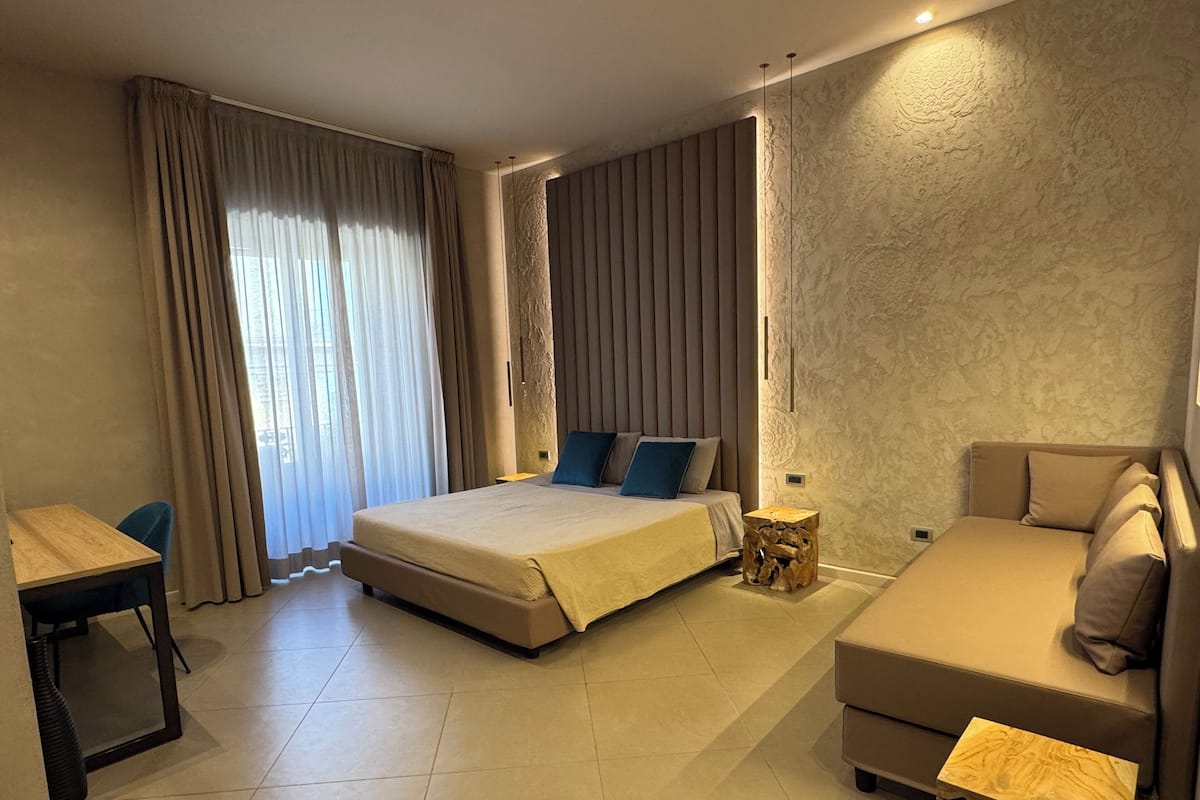 Deluxe Triple Room, 1 King Bed with Sofa bed, Balcony, City View | Minibar, in-room safe, blackout drapes, soundproofing