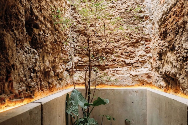 Deluxe Double Room, Courtyard View | Living area | 70-inch LED TV with digital channels, Netflix, smart speakers