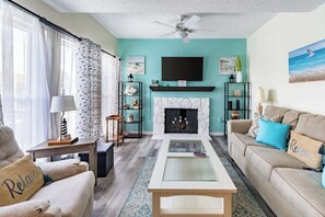 Smart TV, fireplace, books, offices