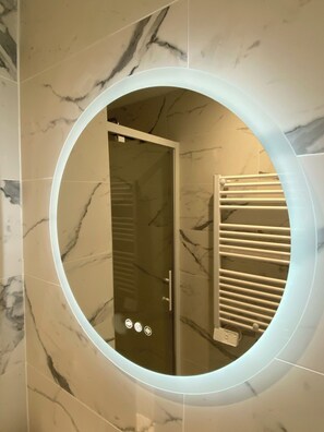 Shower, hair dryer, towels, toilet paper