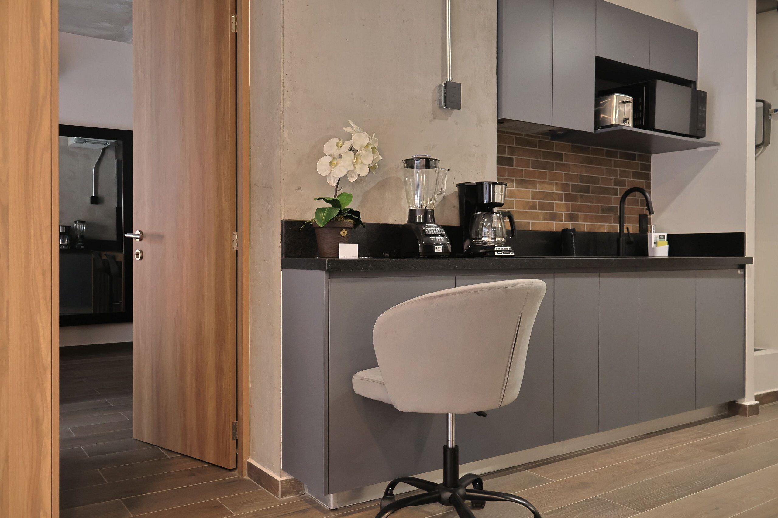 Fridge, microwave, coffee/tea maker, cookware/dishes/utensils