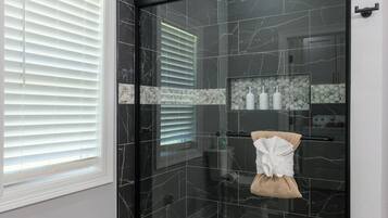 Shower, hair dryer, towels, soap