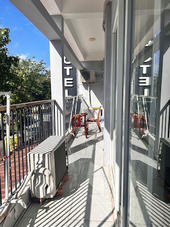 Standard Triple Room, City View | Terrace/patio