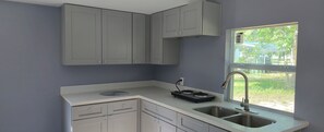 Fridge, stovetop, coffee/tea maker, electric kettle