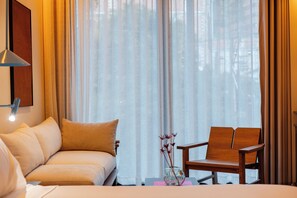 Design Studio Suite | Premium bedding, minibar, in-room safe, desk