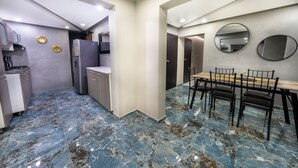 A modern kitchen with a dining area. - Amazing 5 bedroom with Incredible Private Jacuzzi  1 block from LLeras (Medellín)
