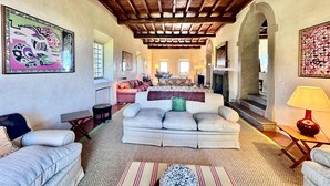 A spacious living area with a high wooden ceiling, a fireplace, and a cozy seating arrangement. - New Estate of Joy a Magnificent Historic Villa Near Rome on Glorious Ground Pool and Olives Galore (Ronciglione)