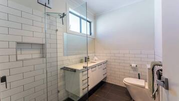 Shower, hair dryer, towels, shampoo
