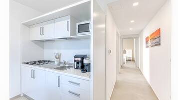 Fridge, microwave, stovetop, coffee/tea maker