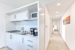Fridge, microwave, stovetop, coffee/tea maker