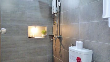 Shower, hair dryer, slippers, towels