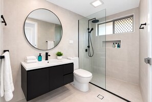 Shower, hair dryer, towels, soap