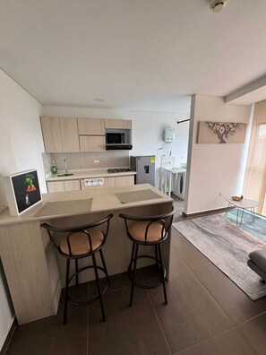 Fridge, microwave, cookware/dishes/utensils