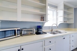 Fridge, microwave, coffee/tea maker, toaster