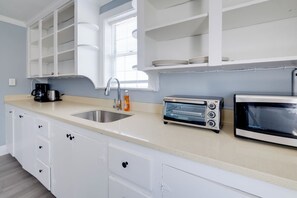Fridge, microwave, coffee/tea maker, toaster