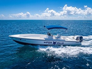 A speedboat named 'The Fox Villa' on water.